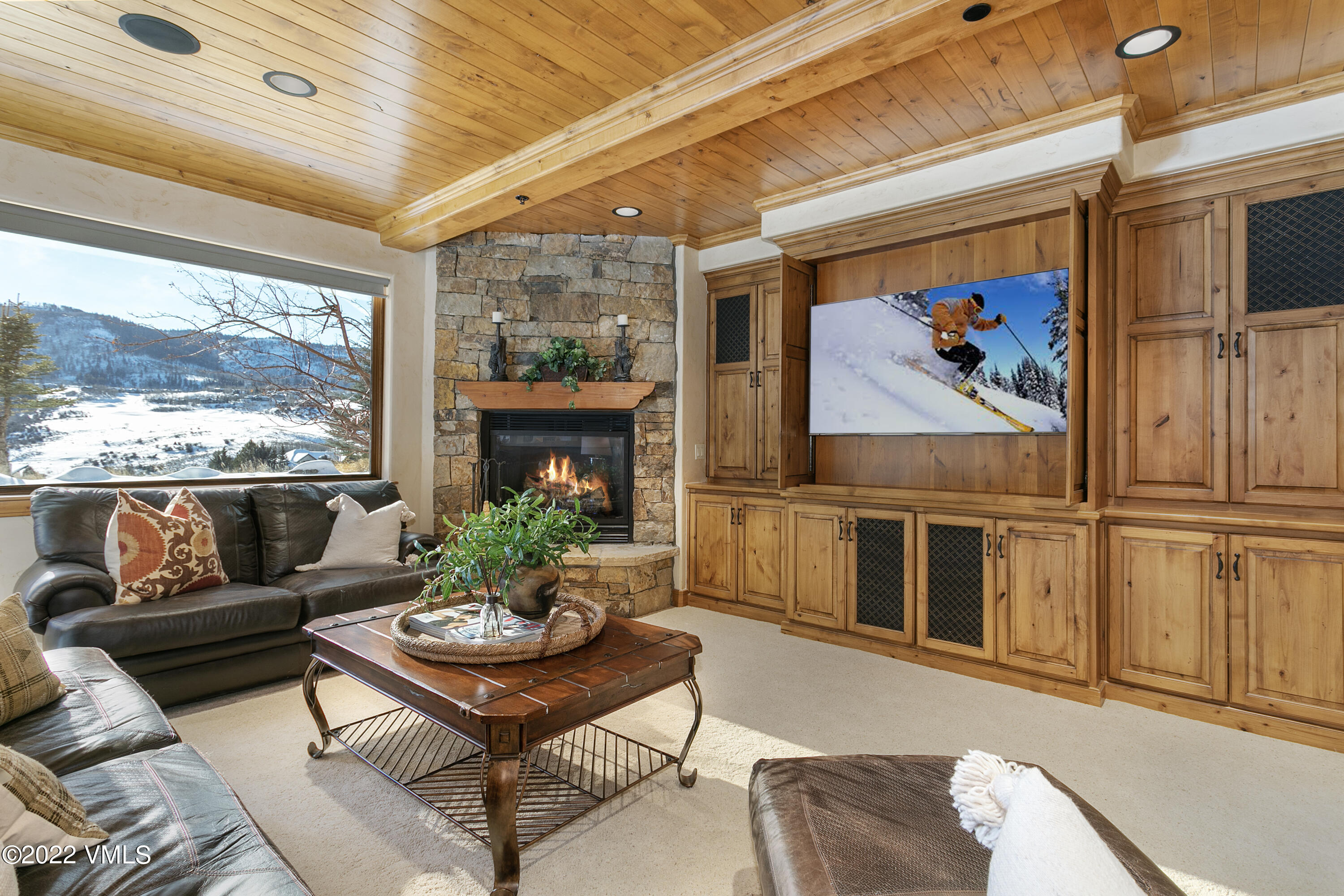 875 Cordillera Way Edwards, CO 81632 - Photo 30 of 57 a living room with furniture fireplace and a large window