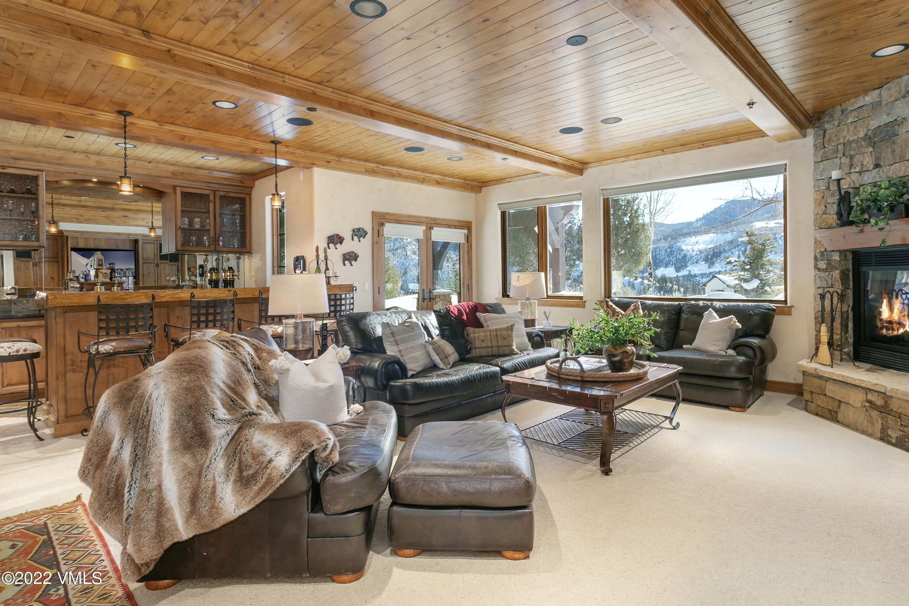 875 Cordillera Way Edwards, CO 81632 - Photo 31 of 57 a living room with furniture and a large window