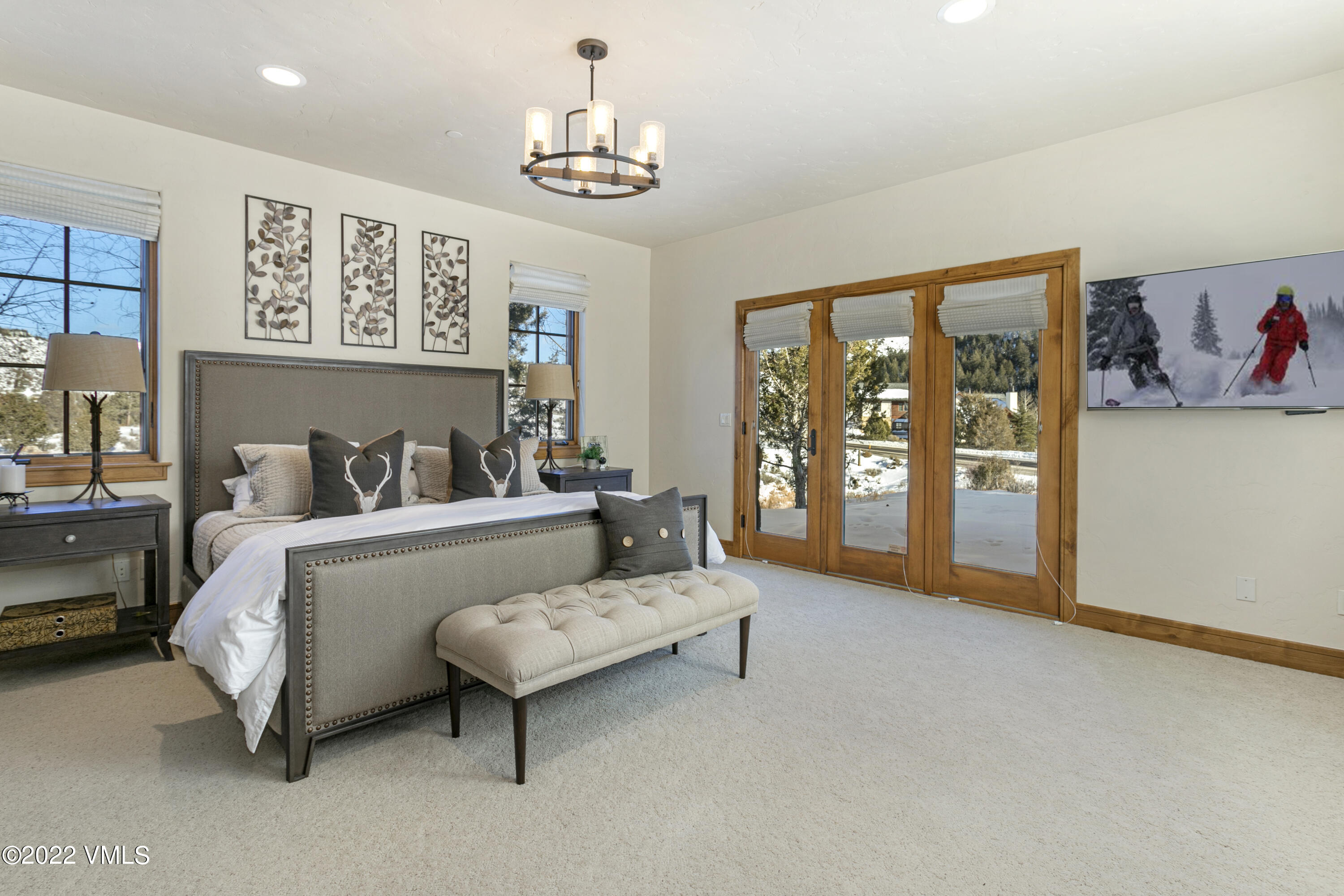 875 Cordillera Way Edwards, CO 81632 - Photo 37 of 57 a spacious bedroom with a bed and a couch