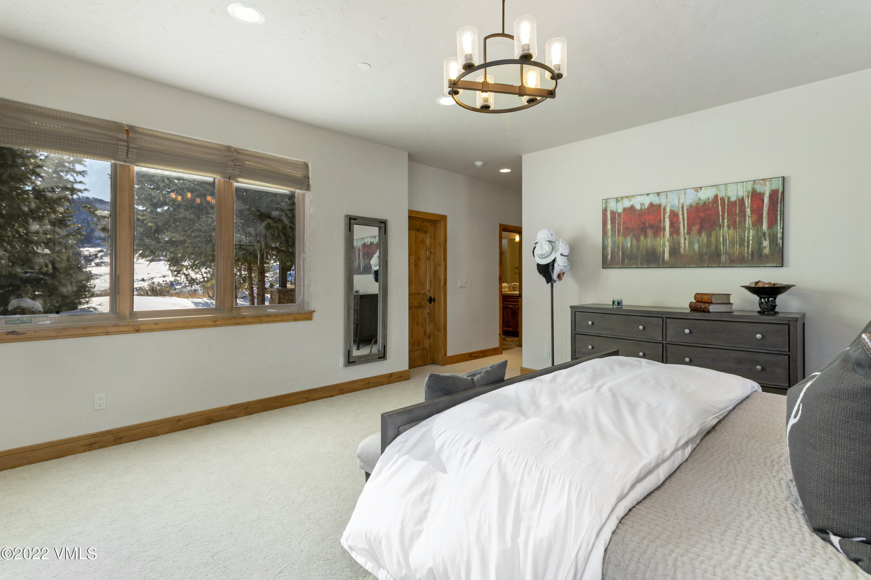 875 Cordillera Way Edwards, CO 81632 - Photo 38 of 57 a bedroom with a bed and a flat screen tv