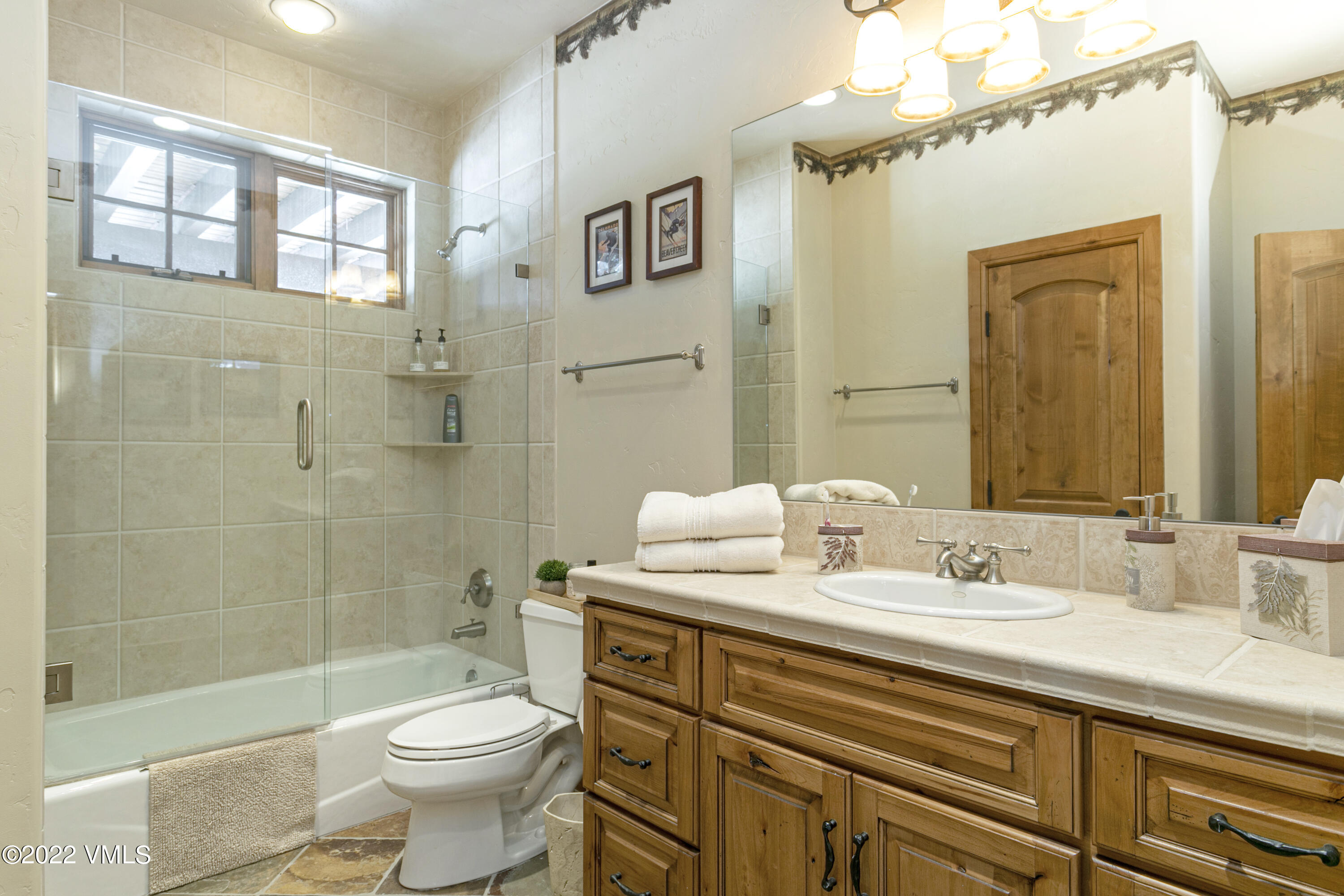 875 Cordillera Way Edwards, CO 81632 - Photo 39 of 57 a bathroom with a sink a toilet and shower