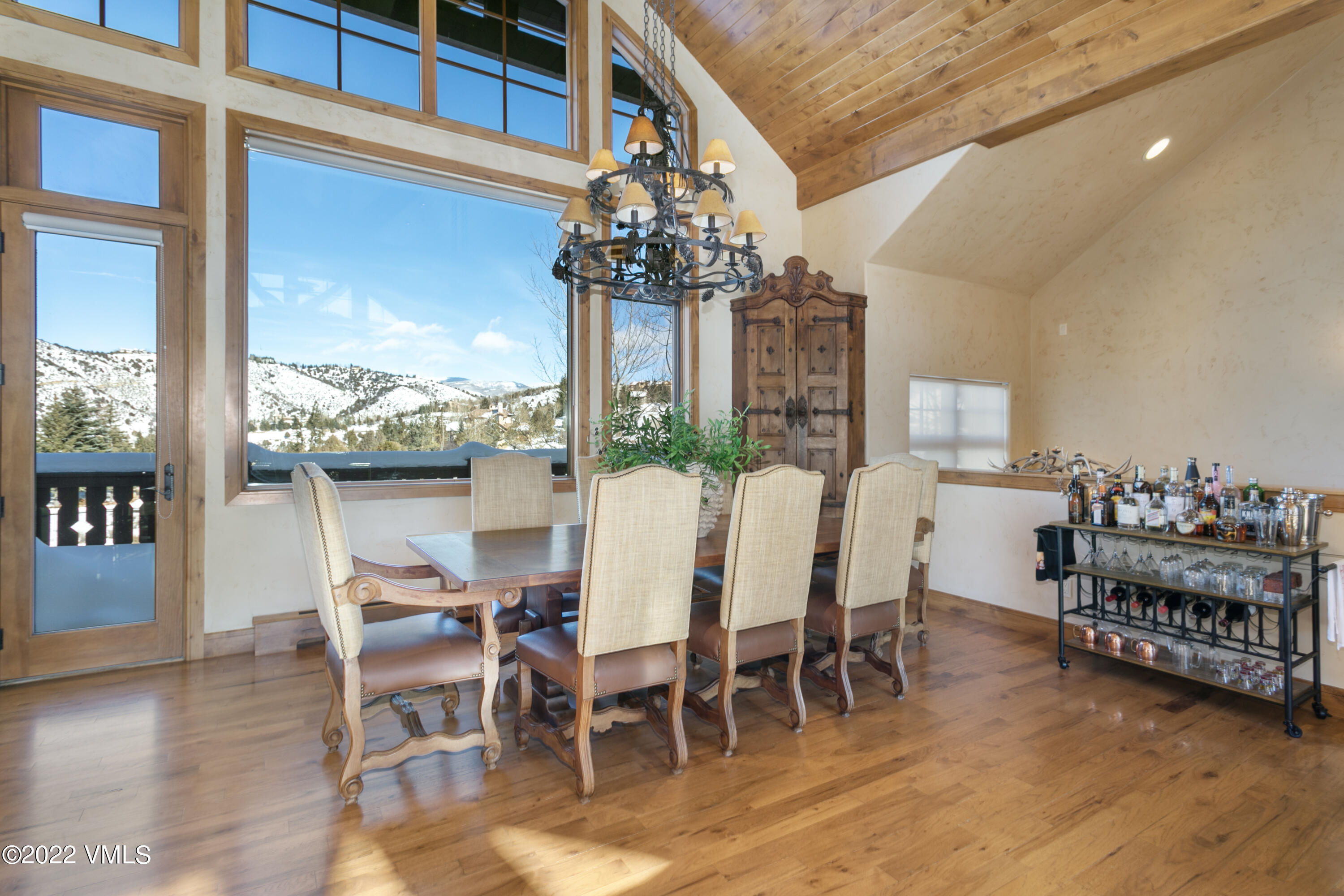 875 Cordillera Way Edwards, CO 81632 - Photo 5 of 57 a view of a dining room with furniture window and wooden floor