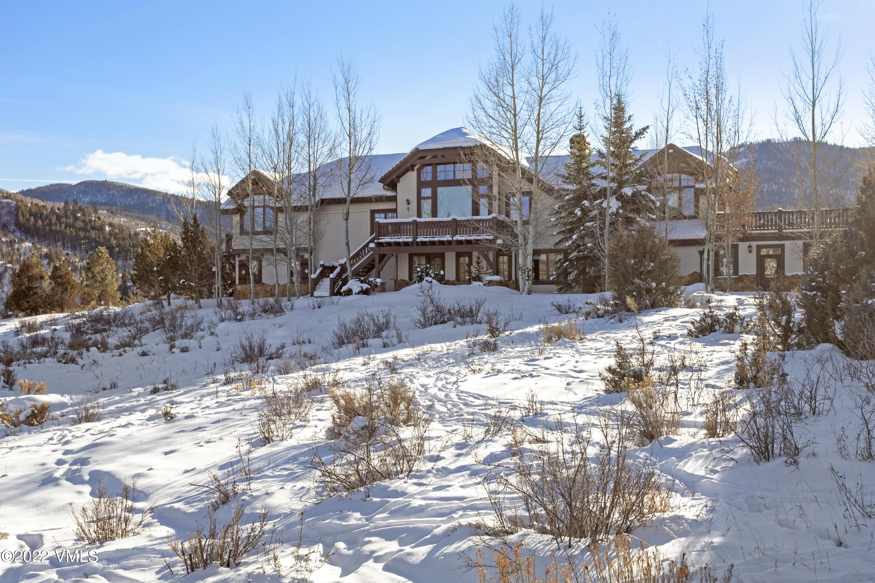 875 Cordillera Way Edwards, CO 81632 - Photo 54 of 57 a view of a house with a yard covered in snow