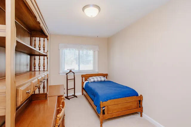 a bedroom with furniture and a window