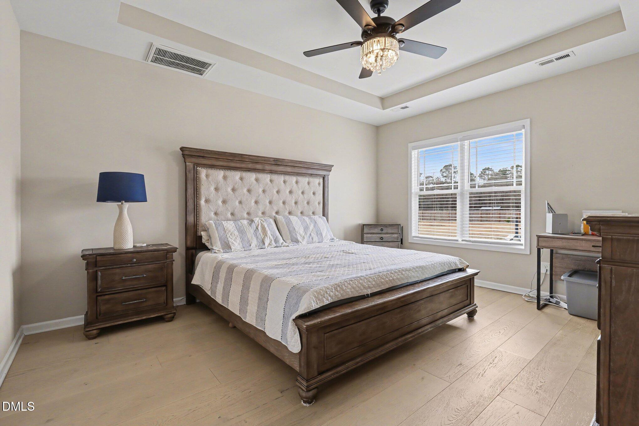 1405 New Daniels Chapel Road Fremont, NC 27830 - Photo 12 of 20 a bed sitting in a bedroom next to a window