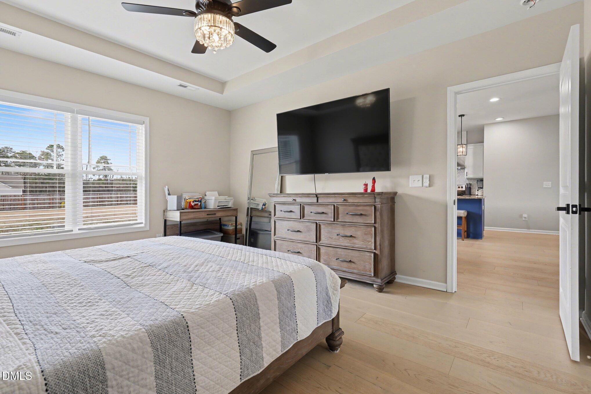 1405 New Daniels Chapel Road Fremont, NC 27830 - Photo 13 of 20 a bedroom with a bed and a flat screen tv
