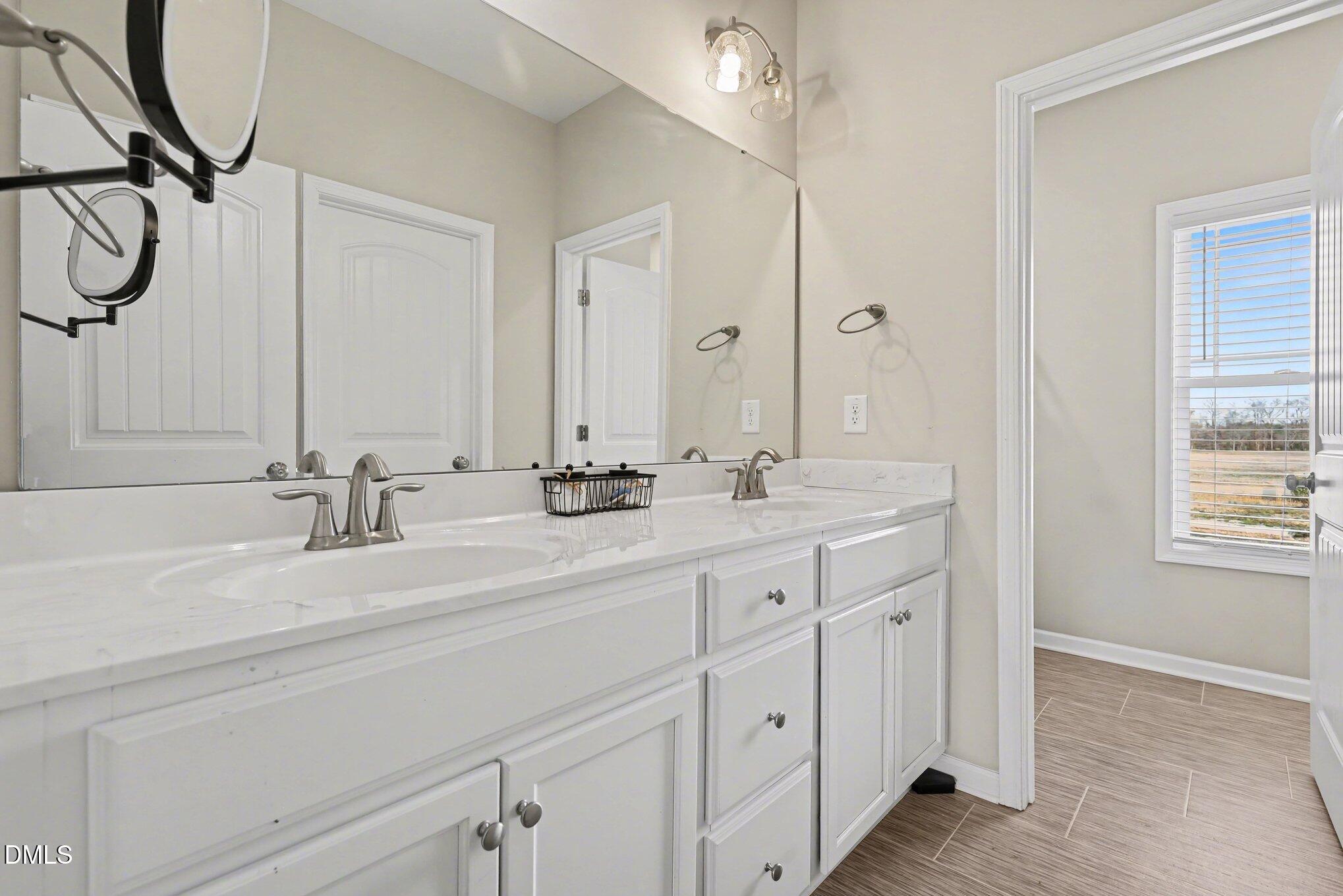 1405 New Daniels Chapel Road Fremont, NC 27830 - Photo 14 of 20 a bathroom with double vanity sink and a mirror