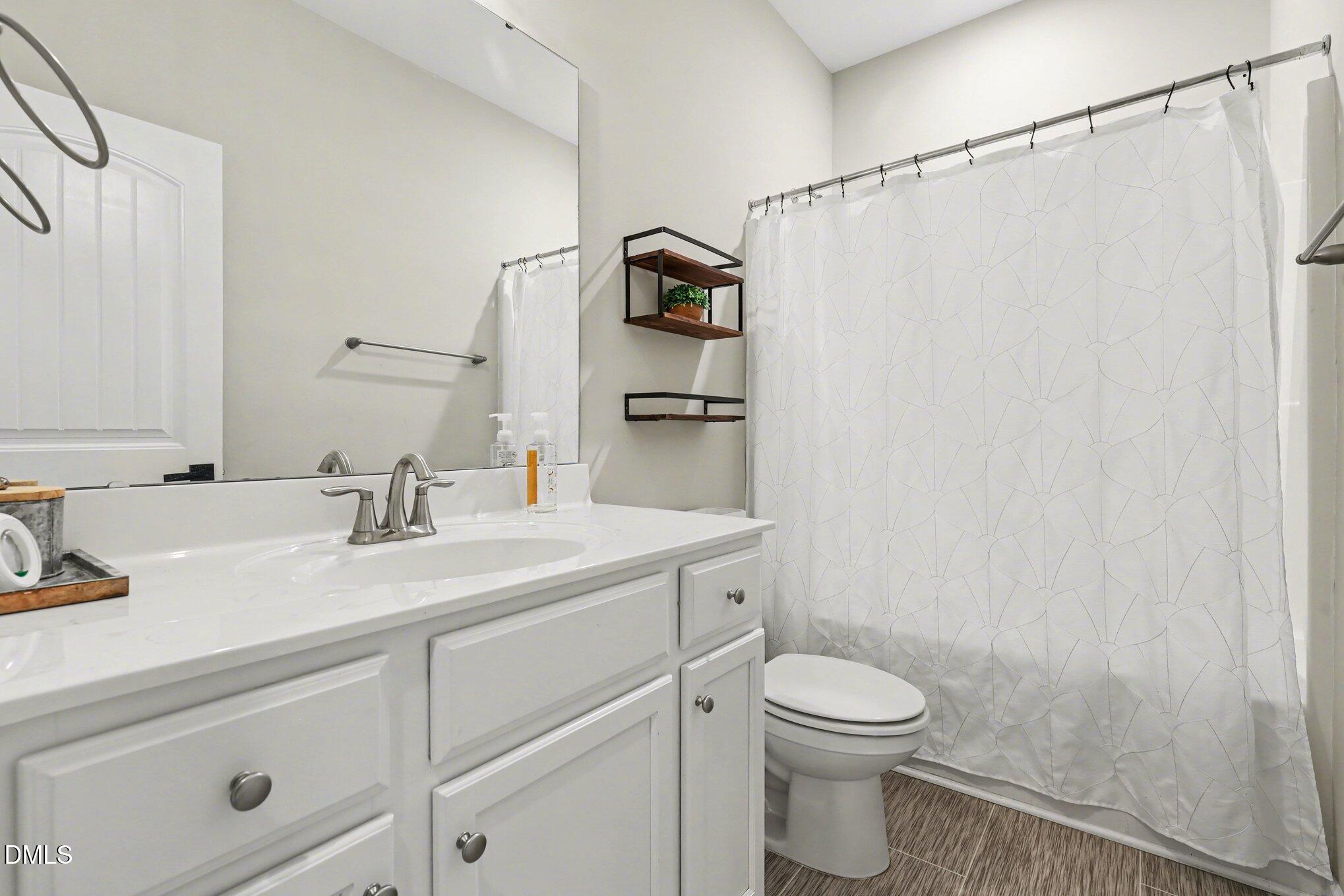 1405 New Daniels Chapel Road Fremont, NC 27830 - Photo 15 of 20 a bathroom with a sink a toilet and shower