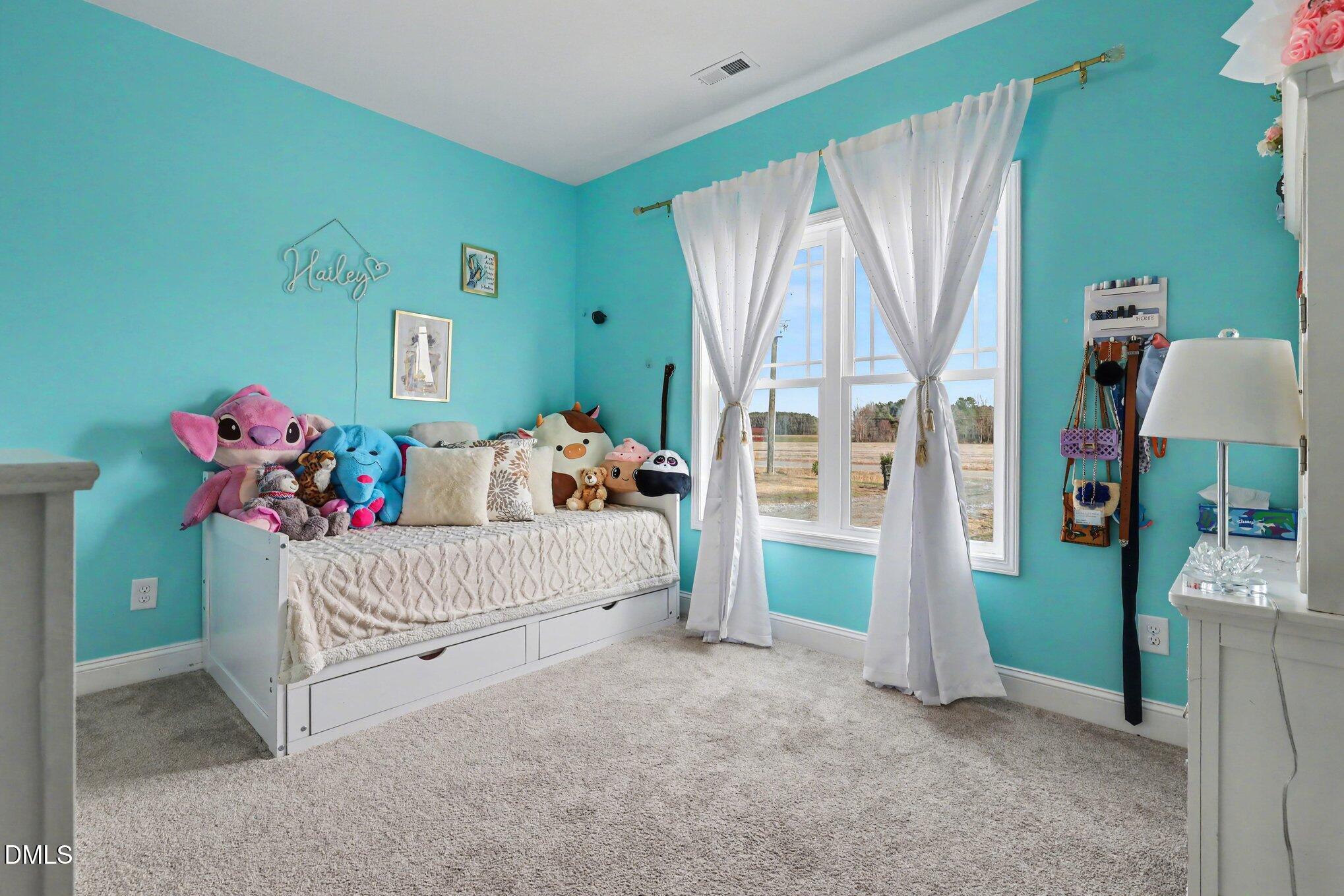 1405 New Daniels Chapel Road Fremont, NC 27830 - Photo 17 of 20 a living room with a baby crib furniture and a baby crib