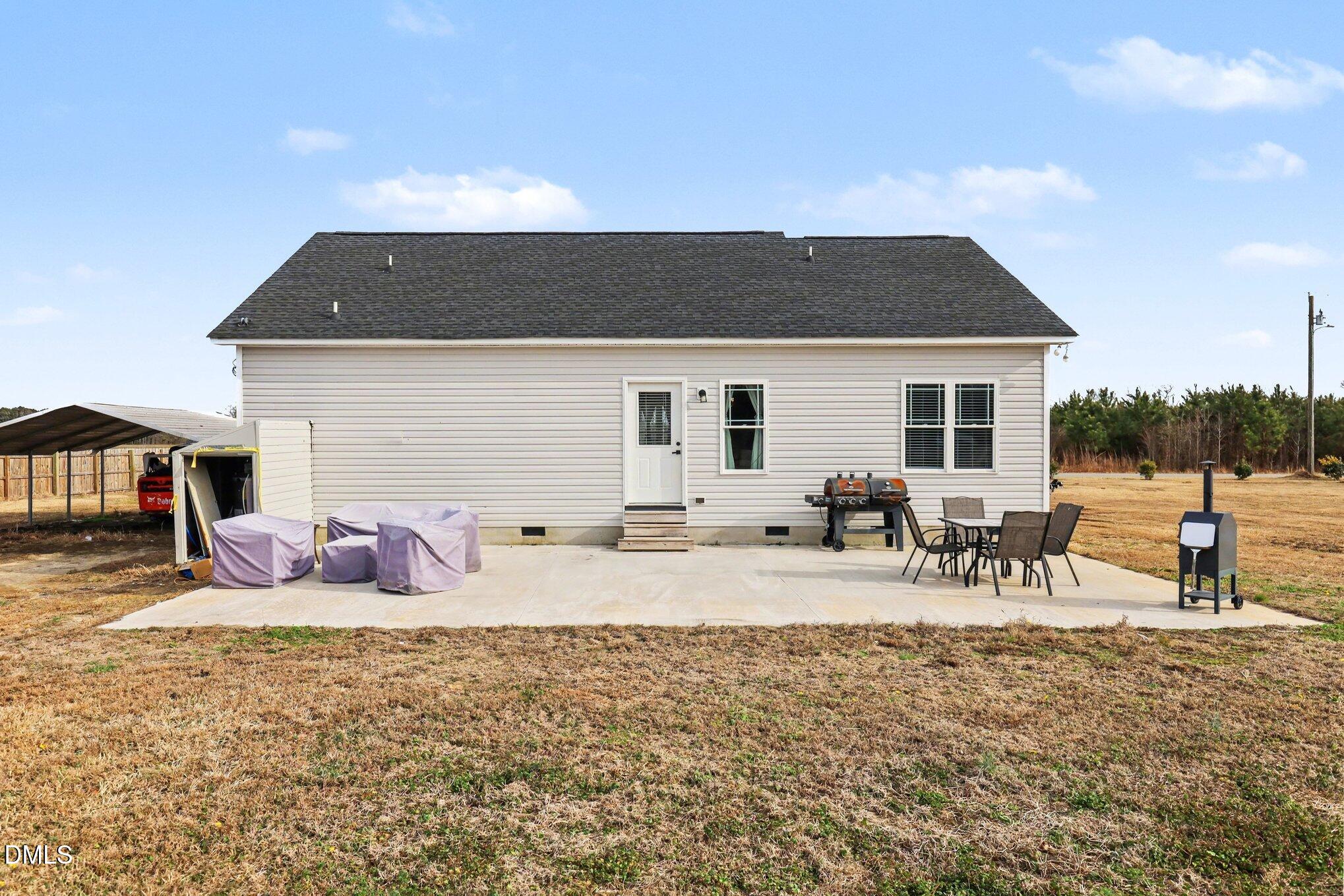 1405 New Daniels Chapel Road Fremont, NC 27830 - Photo 18 of 20 a view of a house with backyard and sitting area