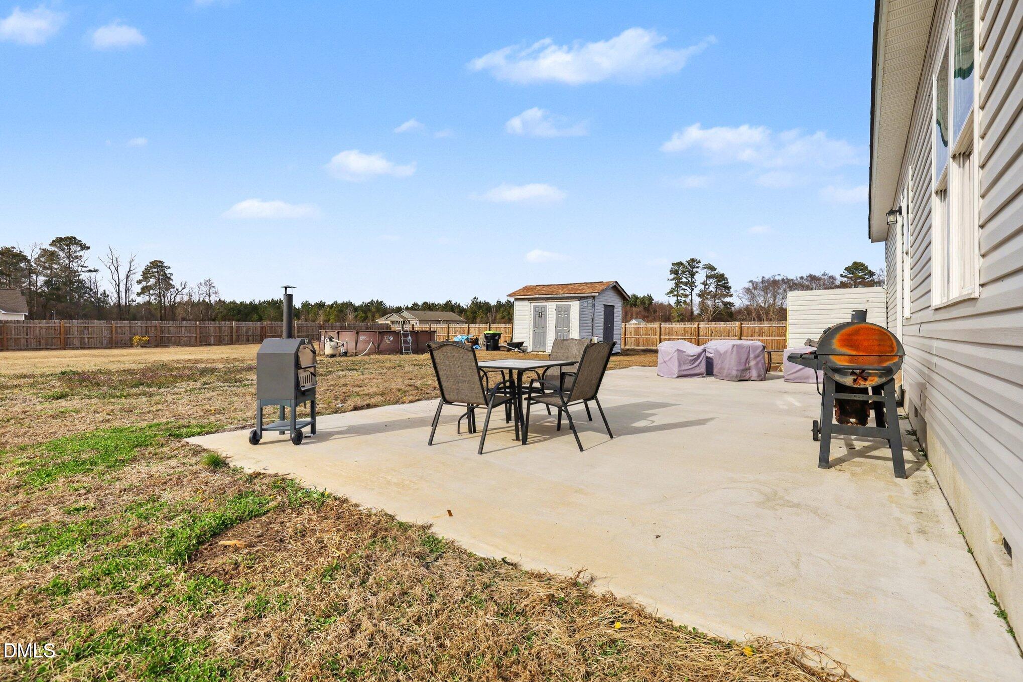 1405 New Daniels Chapel Road Fremont, NC 27830 - Photo 19 of 20 a terrace with outdoor seating and city view
