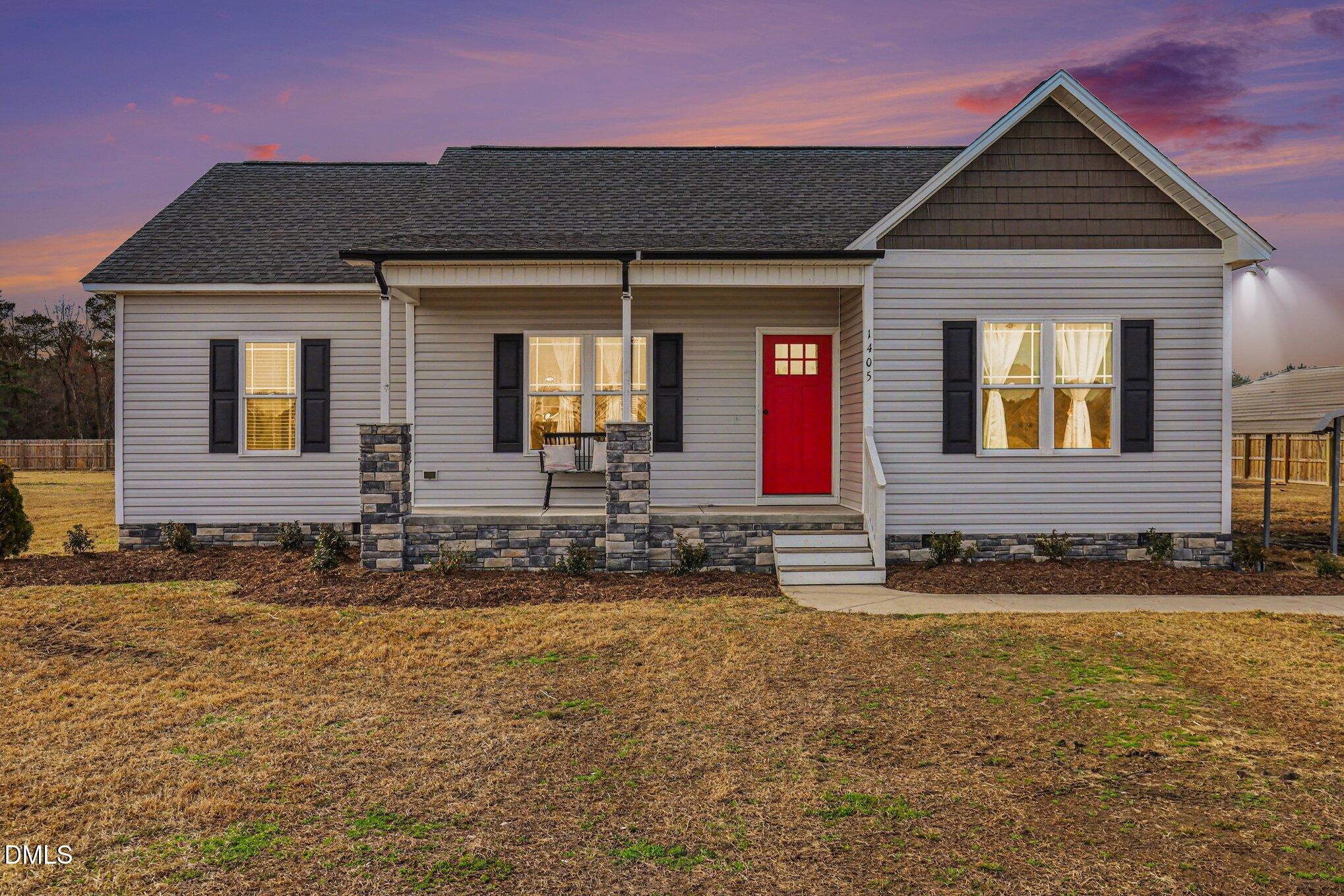 1405 New Daniels Chapel Road Fremont, NC 27830 - Photo 2 of 20 a front view of a house with a yard