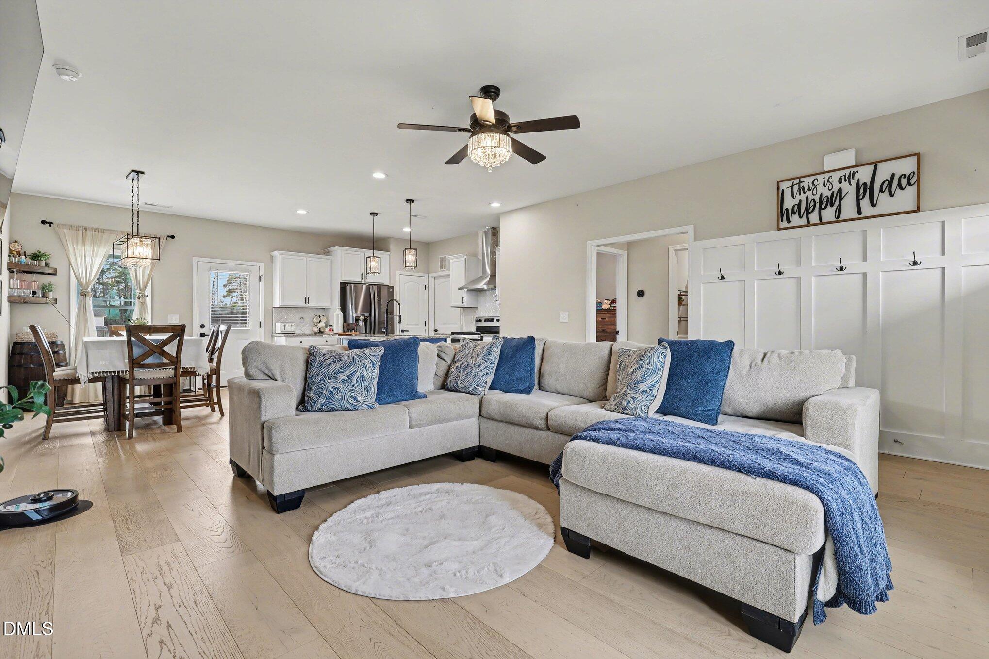 1405 New Daniels Chapel Road Fremont, NC 27830 - Photo 6 of 20 a living room with furniture and a chandelier