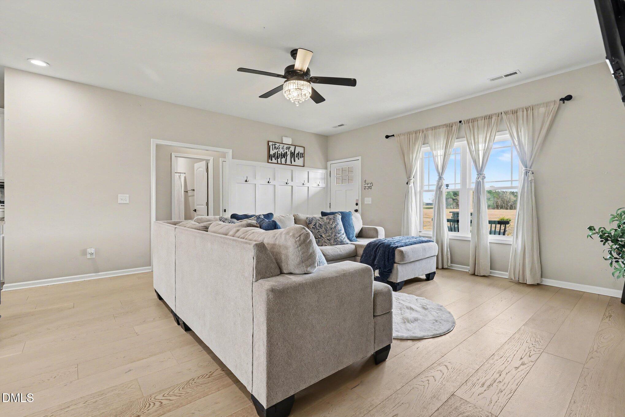 1405 New Daniels Chapel Road Fremont, NC 27830 - Photo 7 of 20 a living room with furniture and a large window