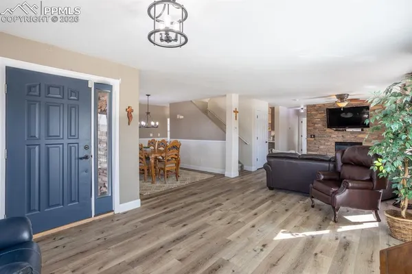 a view of a livingroom with furniture and a flat screen tv