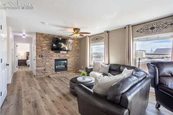 a living room with furniture and a fireplace