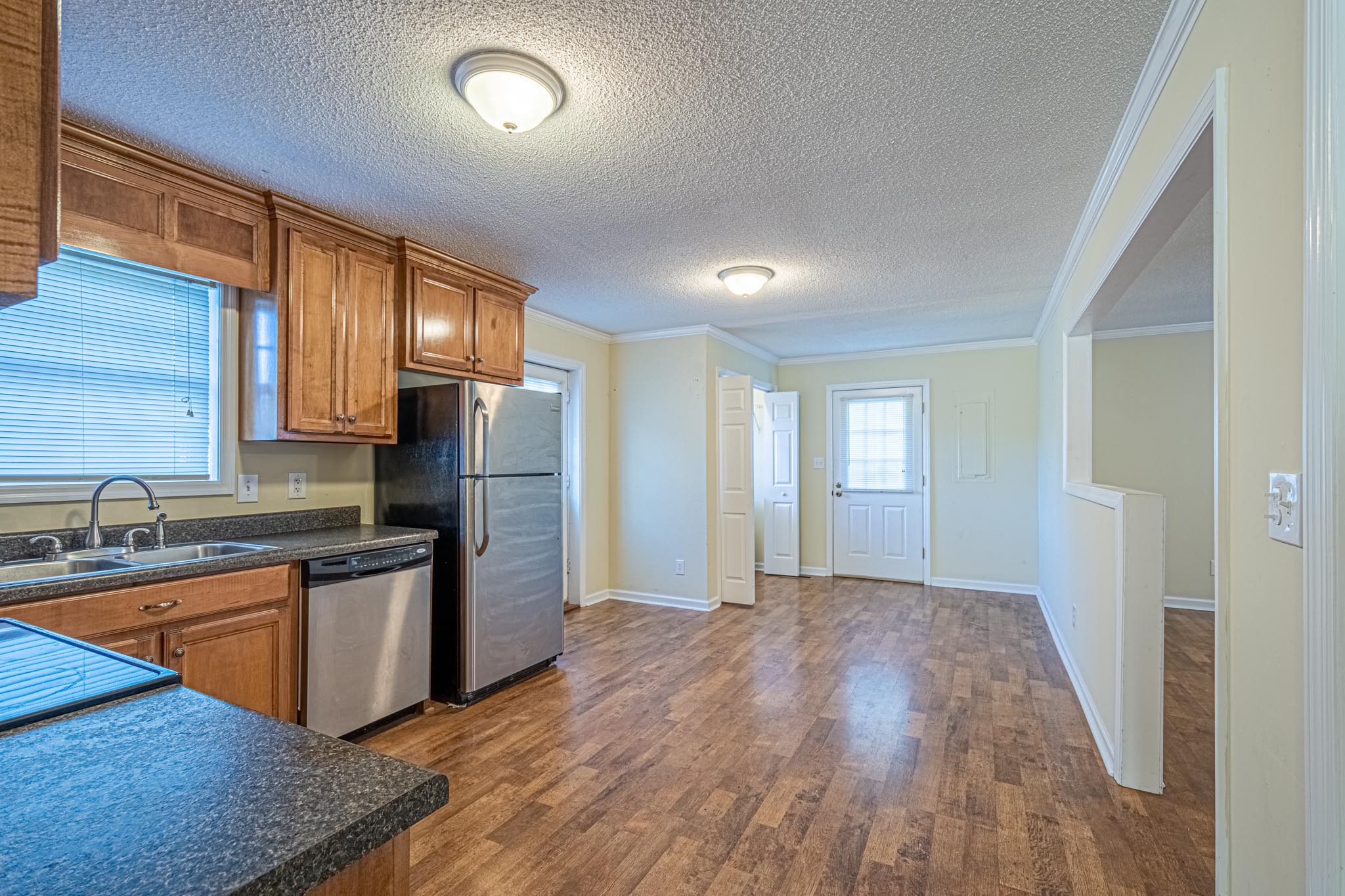 2294 Oak Grove Road Goodspring, TN 38460 - Photo 13 of 40 a kitchen with stainless steel appliances granite countertop a sink stove and refrigerator
