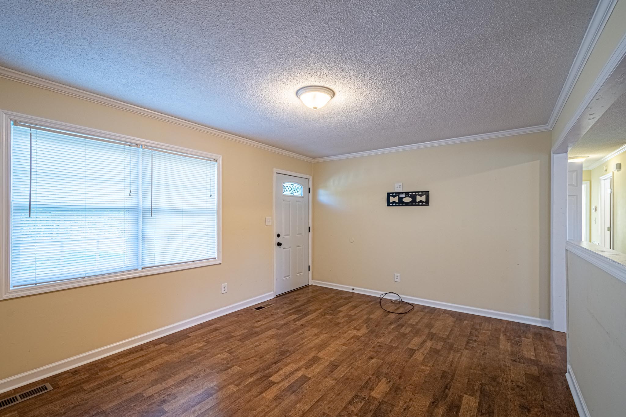 2294 Oak Grove Road Goodspring, TN 38460 - Photo 15 of 40 an empty room with wooden floor and windows