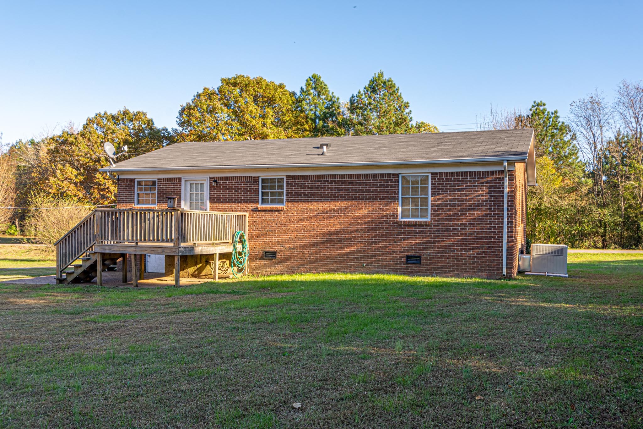 2294 Oak Grove Road Goodspring, TN 38460 - Photo 32 of 40 a view of a house with a big yard and large trees