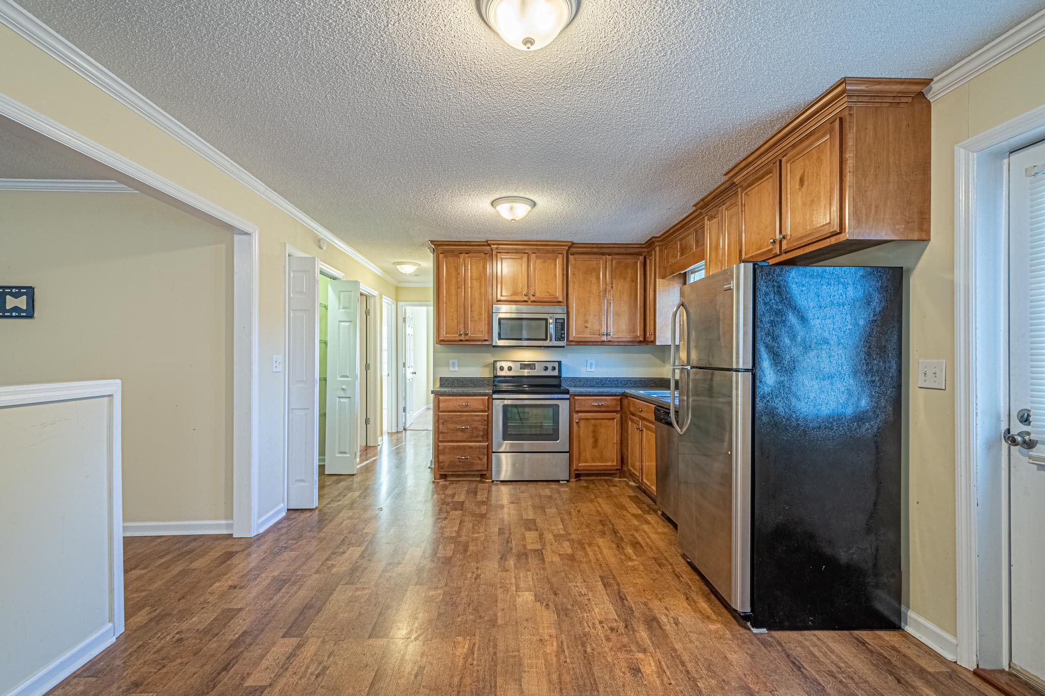 2294 Oak Grove Road Goodspring, TN 38460 - Photo 6 of 40 a kitchen with stainless steel appliances a refrigerator and a stove top oven