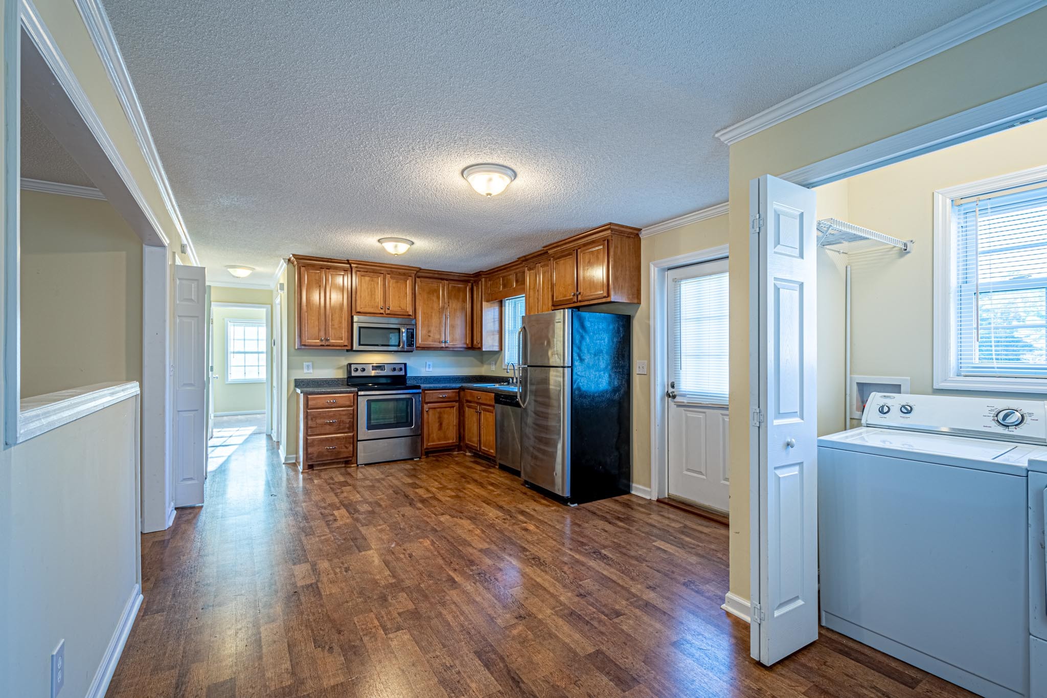 2294 Oak Grove Road Goodspring, TN 38460 - Photo 7 of 40 a kitchen with stainless steel appliances kitchen island granite countertop a refrigerator a sink and a stove