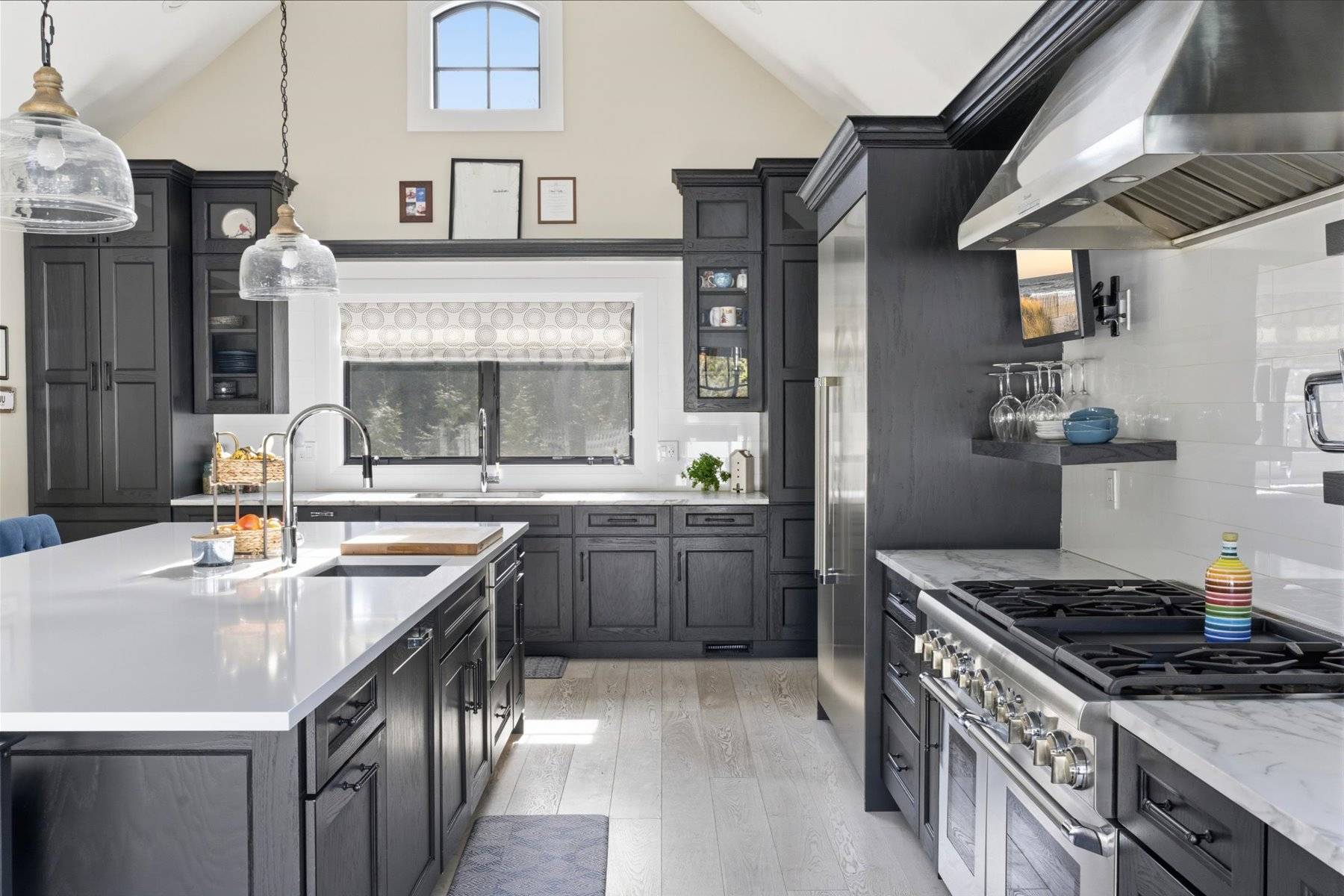 4 Post Lane Quogue, NY 11959 - Photo 19 of 42 a kitchen with stainless steel appliances granite countertop a sink stove and refrigerator