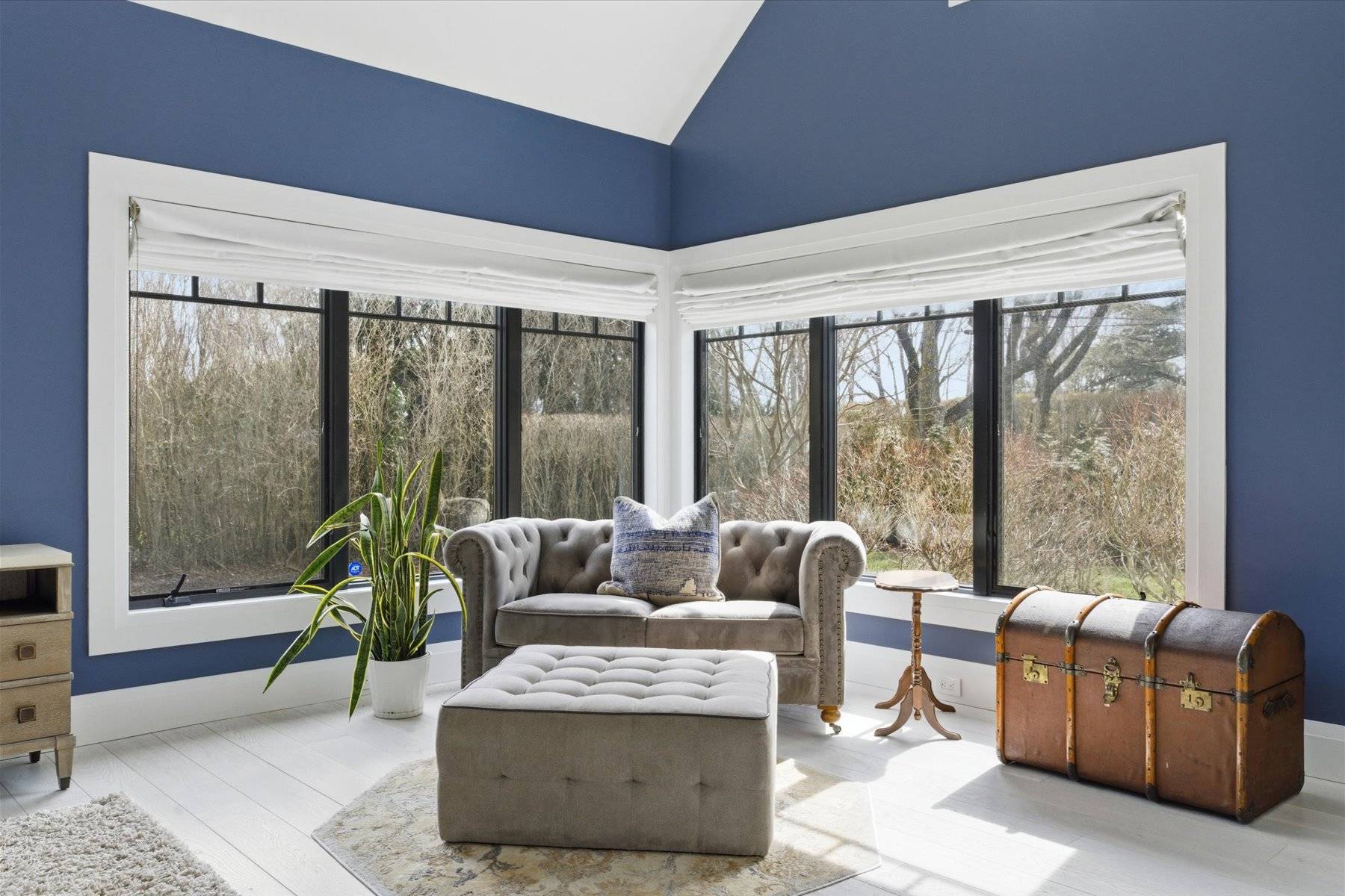 4 Post Lane Quogue, NY 11959 - Photo 23 of 42 a living room with furniture and a large window