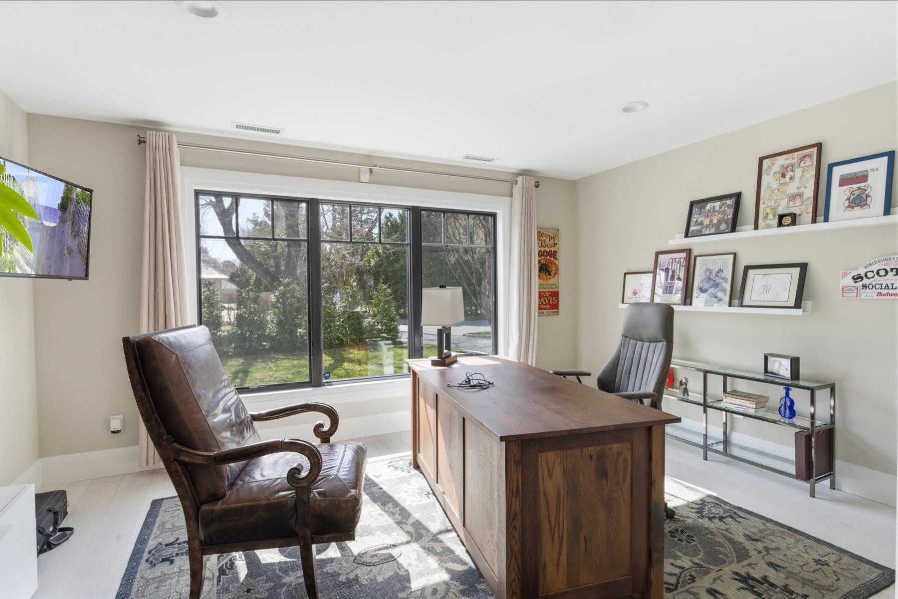 4 Post Lane Quogue, NY 11959 - Photo 36 of 42 a living room with furniture and a large window