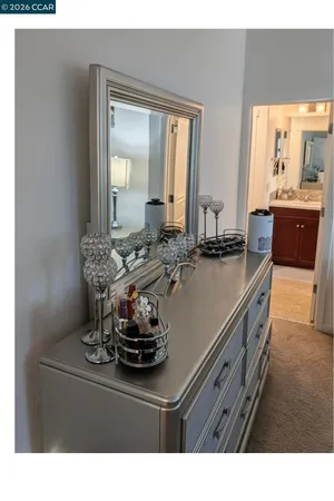 a kitchen with a sink stove and wooden cabinets