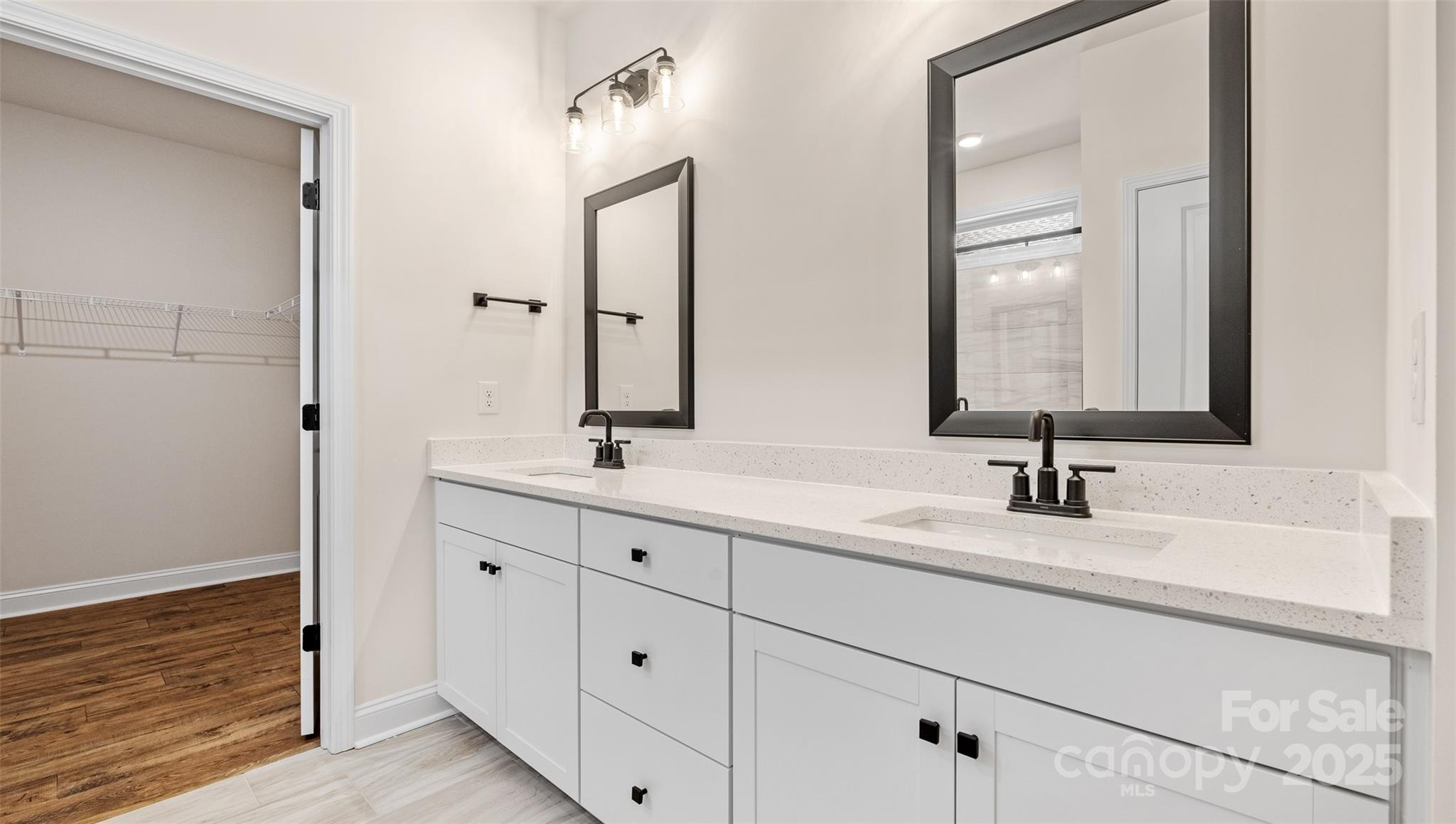 610 River Btm Road Fletcher, NC 28732 - Photo 12 of 28 a bathroom with a double vanity sink and mirror