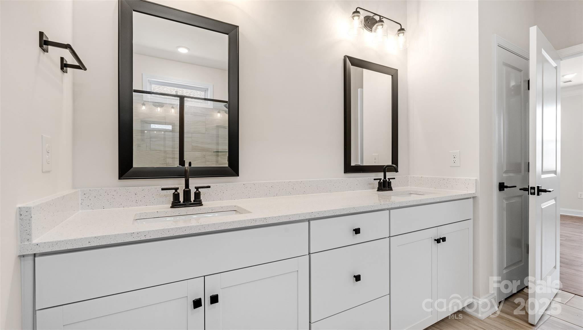 610 River Btm Road Fletcher, NC 28732 - Photo 13 of 28 a bathroom with double vanity sinks and a mirror