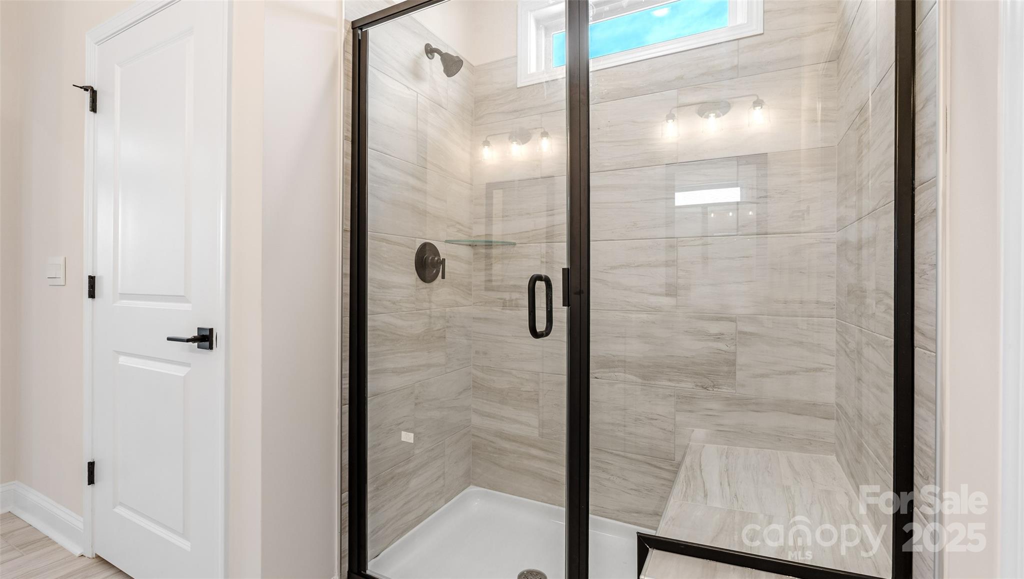 610 River Btm Road Fletcher, NC 28732 - Photo 14 of 28 a bathroom with a glass shower door
