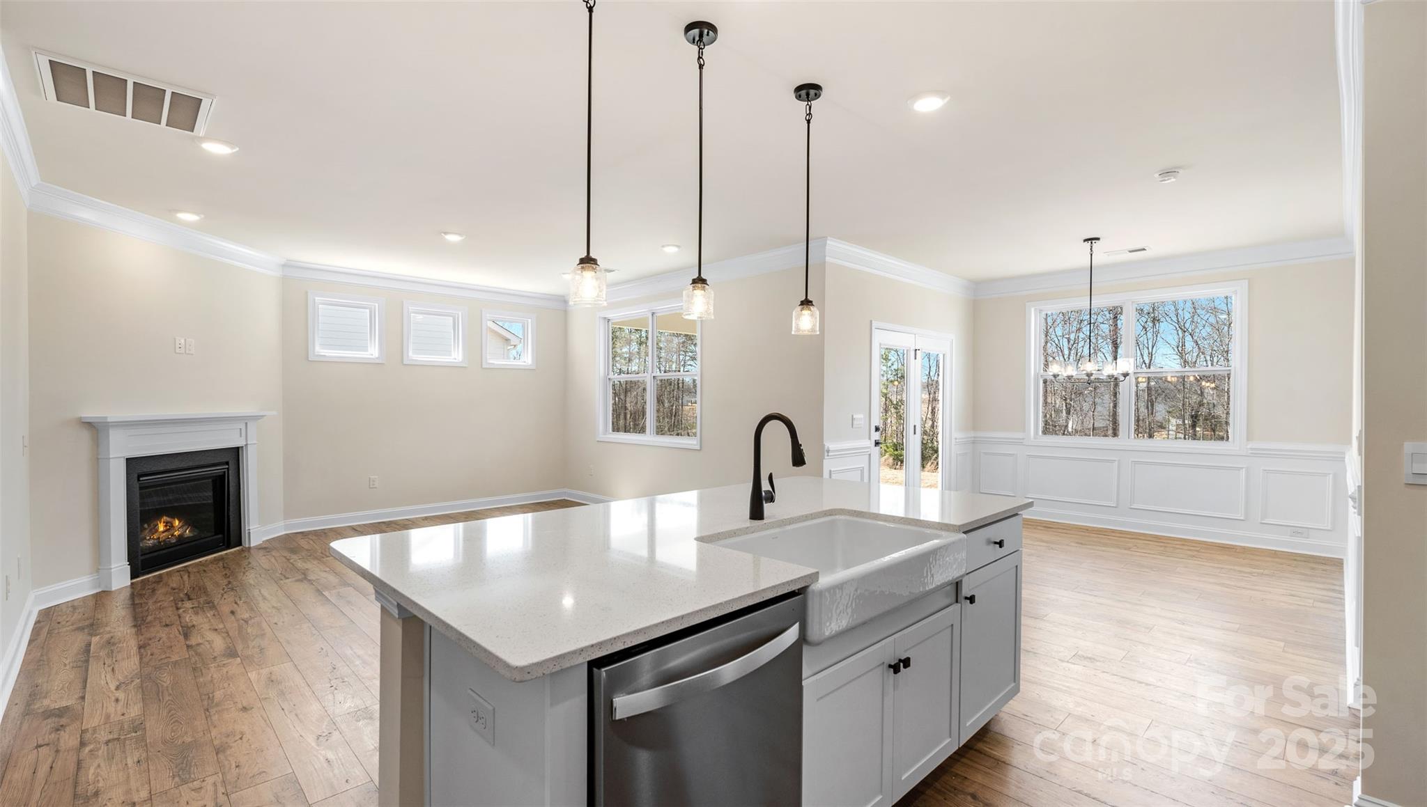 610 River Btm Road Fletcher, NC 28732 - Photo 4 of 28 a kitchen with a sink chandelier and fireplace
