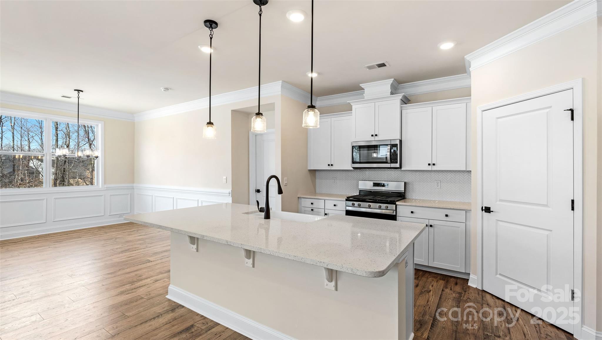 610 River Btm Road Fletcher, NC 28732 - Photo 5 of 28 a kitchen with stainless steel appliances a stove a sink a refrigerator a center island and wooden floor