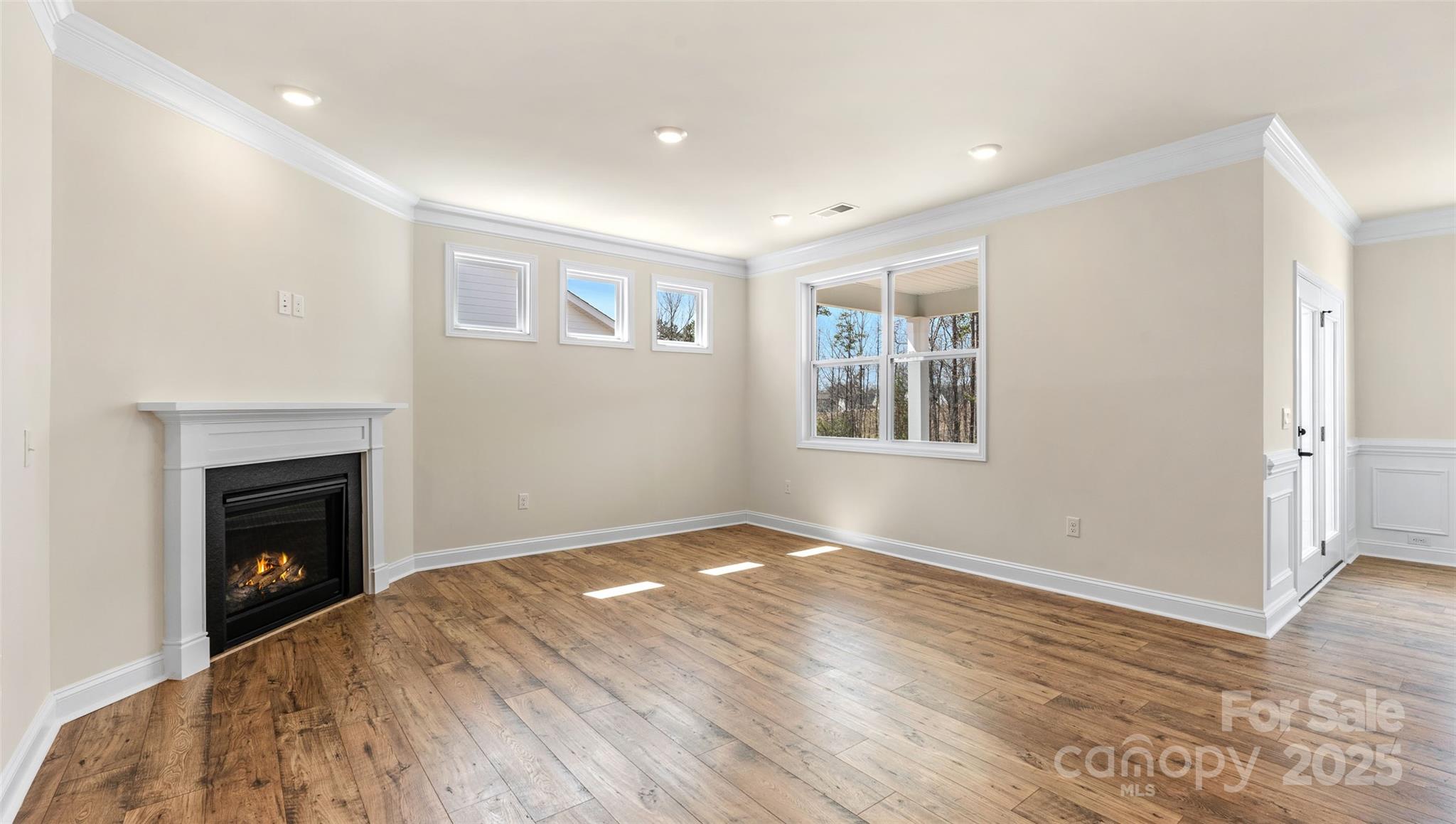 610 River Btm Road Fletcher, NC 28732 - Photo 8 of 28 a view of empty room with wooden floor and fireplace