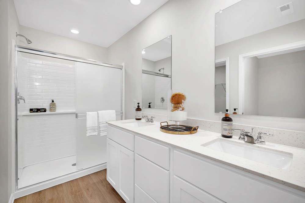 2581 Tahoe Lane Pingree Grove, IL 60140 - Photo 15 of 42 a bathroom with a sink vanity granite tub shower and a mirror