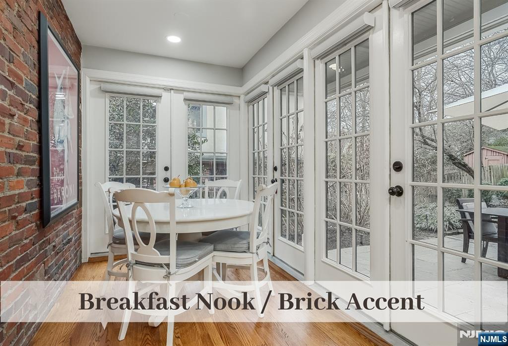 446 Upper Boulevard Ridgewood, NJ 07450 - Photo 15 of 48 a dining room with furniture and wooden floor