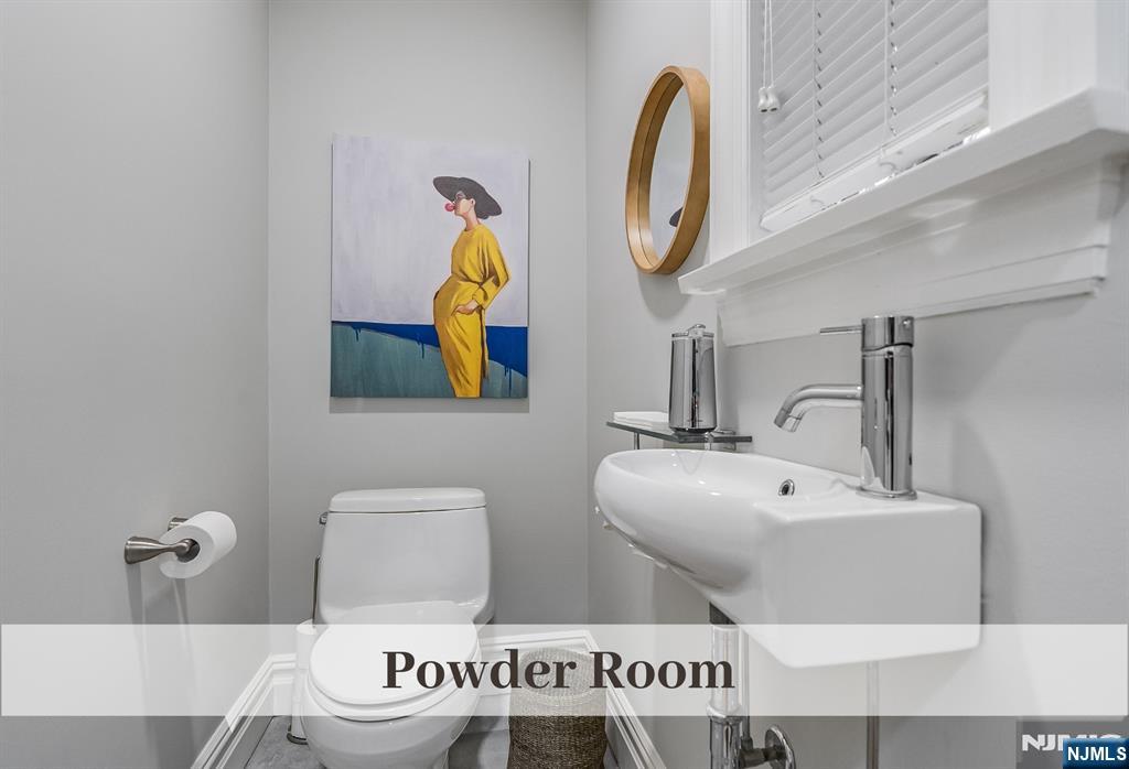 446 Upper Boulevard Ridgewood, NJ 07450 - Photo 18 of 48 a bathroom with a sink mirror and toilet