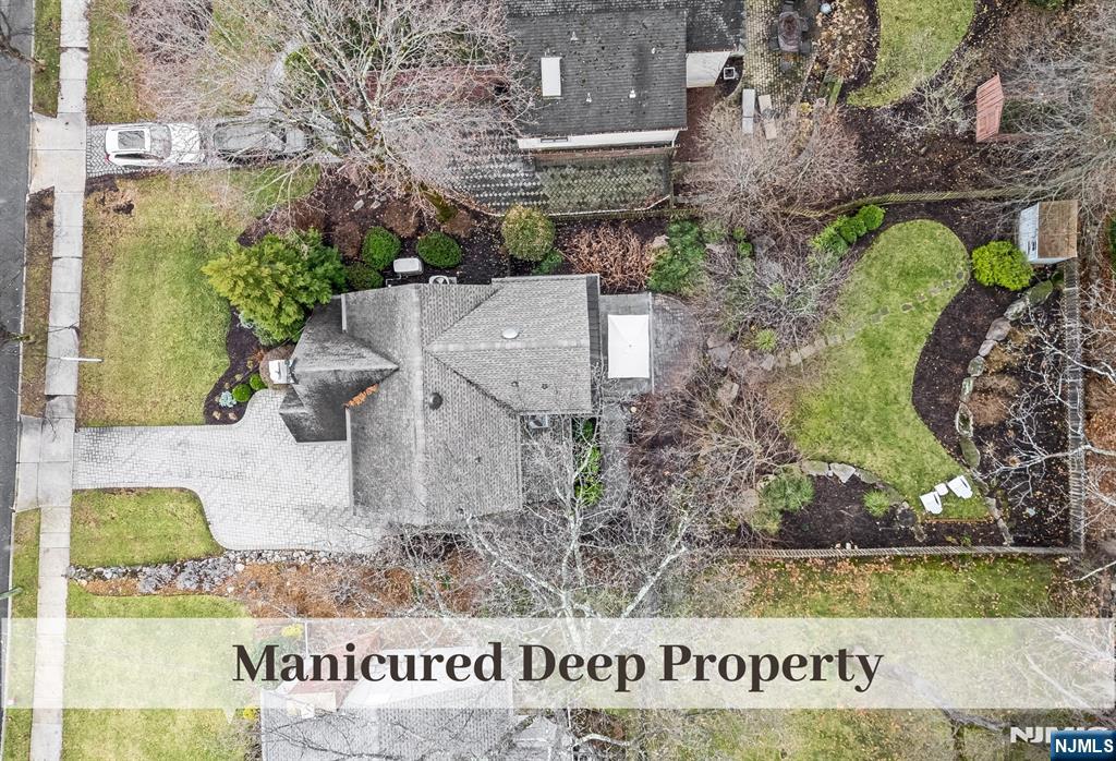 446 Upper Boulevard Ridgewood, NJ 07450 - Photo 2 of 48 front view of a house with a yard