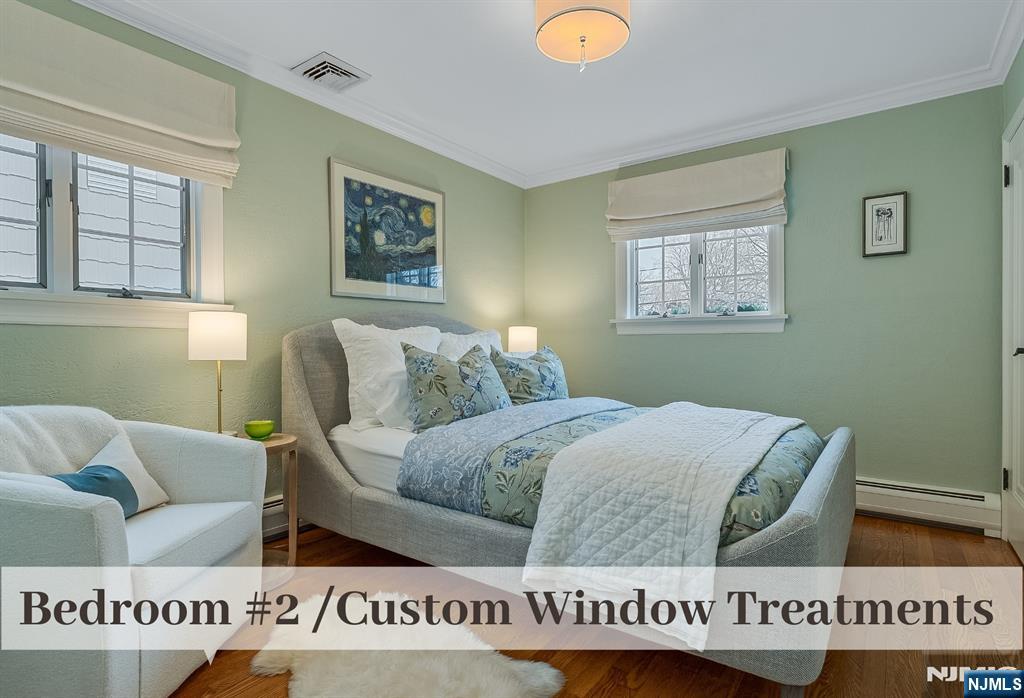 446 Upper Boulevard Ridgewood, NJ 07450 - Photo 26 of 48 a living room with couches and a window