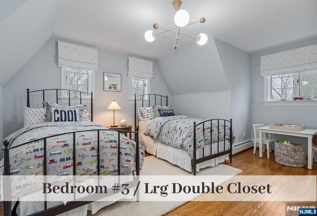 446 Upper Boulevard Ridgewood, NJ 07450 - Photo 27 of 48 a bedroom with furniture and a window