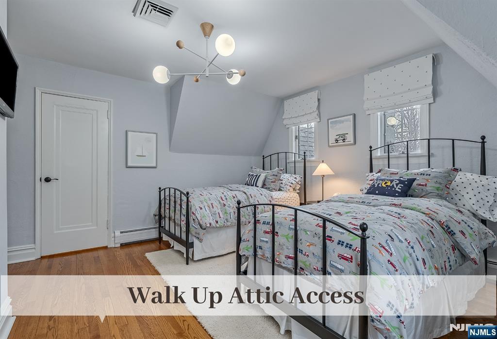 446 Upper Boulevard Ridgewood, NJ 07450 - Photo 28 of 48 a bed room with two beds and a night stand