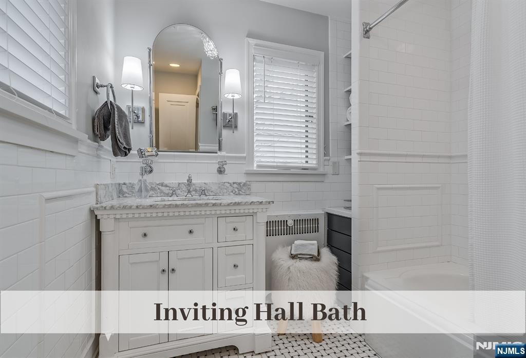 446 Upper Boulevard Ridgewood, NJ 07450 - Photo 29 of 48 a bathroom with a sink and a mirror