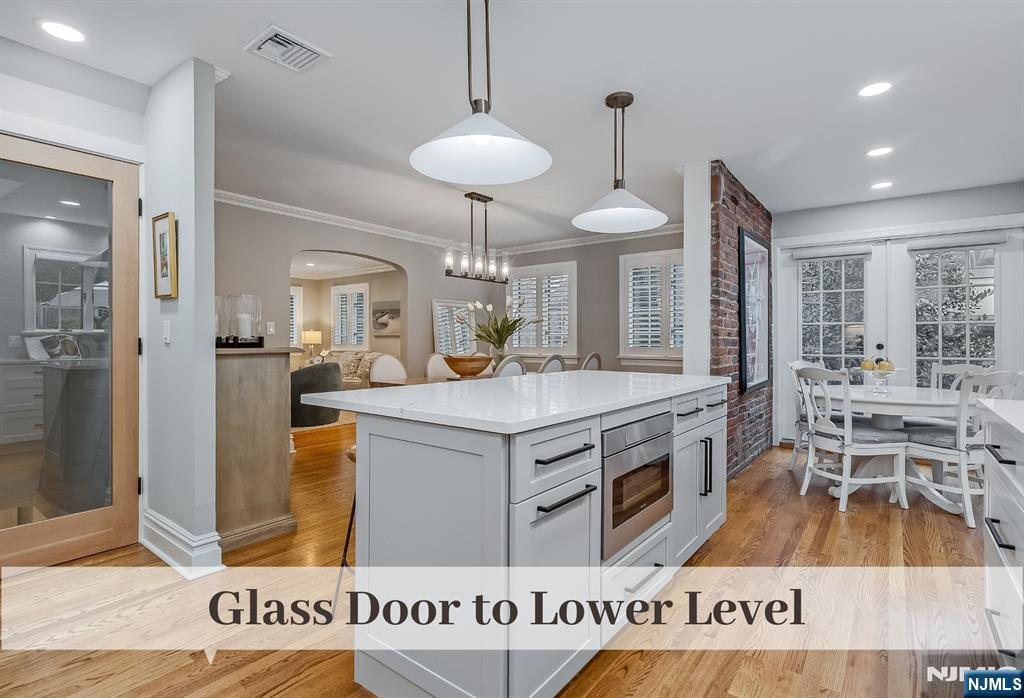 446 Upper Boulevard Ridgewood, NJ 07450 - Photo 31 of 48 a kitchen with stainless steel appliances granite countertop a stove and a refrigerator