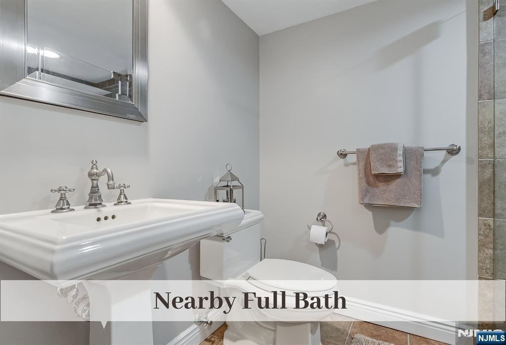 446 Upper Boulevard Ridgewood, NJ 07450 - Photo 35 of 48 a bathroom with a sink and a mirror