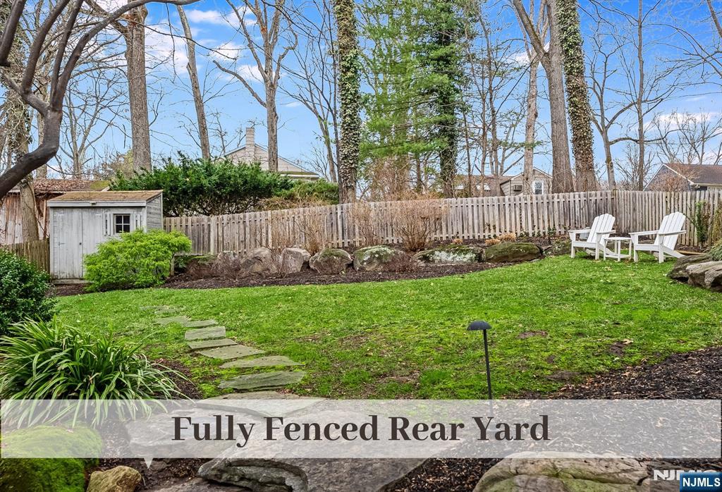 446 Upper Boulevard Ridgewood, NJ 07450 - Photo 39 of 48 a view of a backyard with a garden