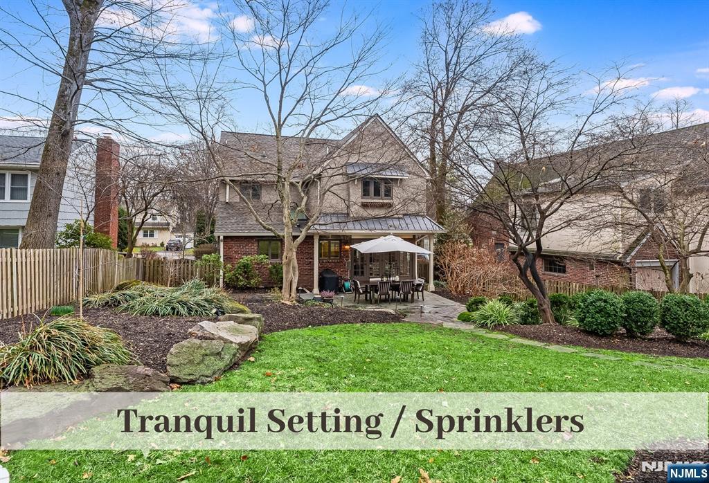 446 Upper Boulevard Ridgewood, NJ 07450 - Photo 41 of 48 front view of a house with a yard