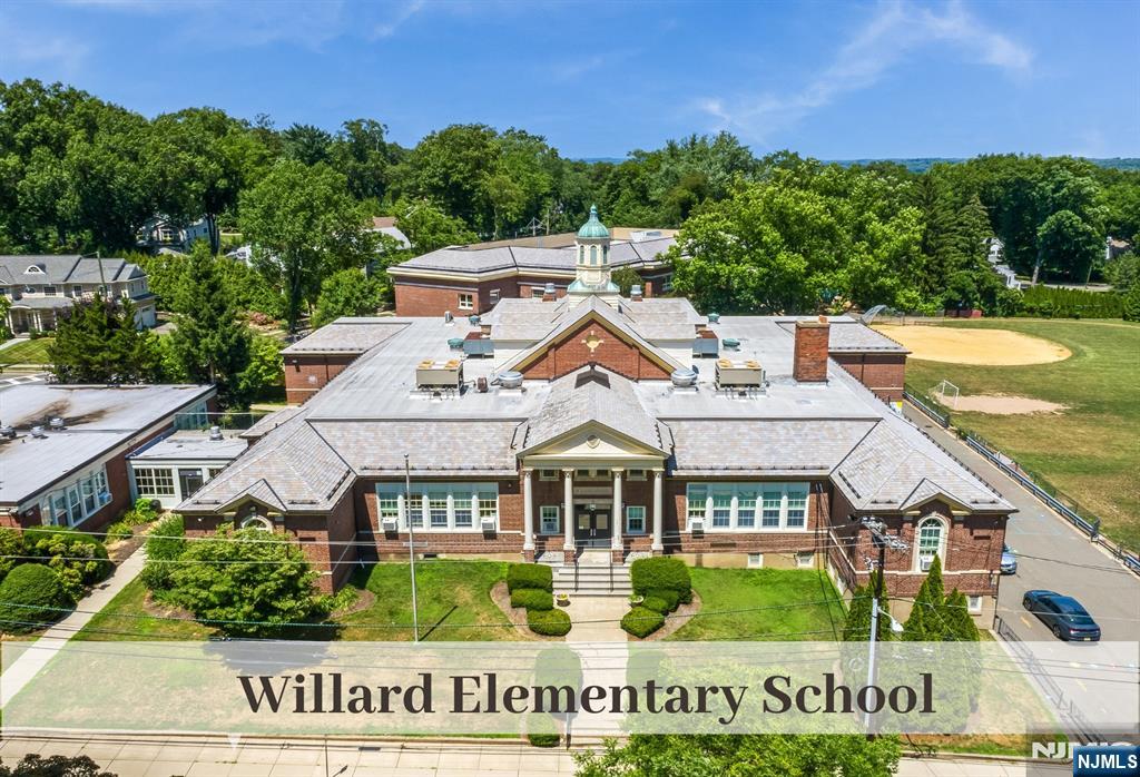 446 Upper Boulevard Ridgewood, NJ 07450 - Photo 45 of 48 an aerial view of a house with a garden