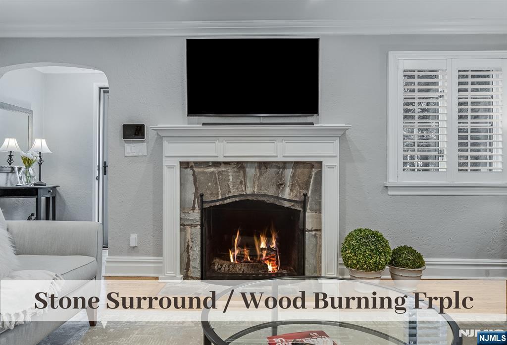 446 Upper Boulevard Ridgewood, NJ 07450 - Photo 6 of 48 a living room with furniture and a fireplace