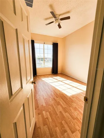 a view of an empty room with a window
